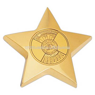 Brass star paper weight with calendar